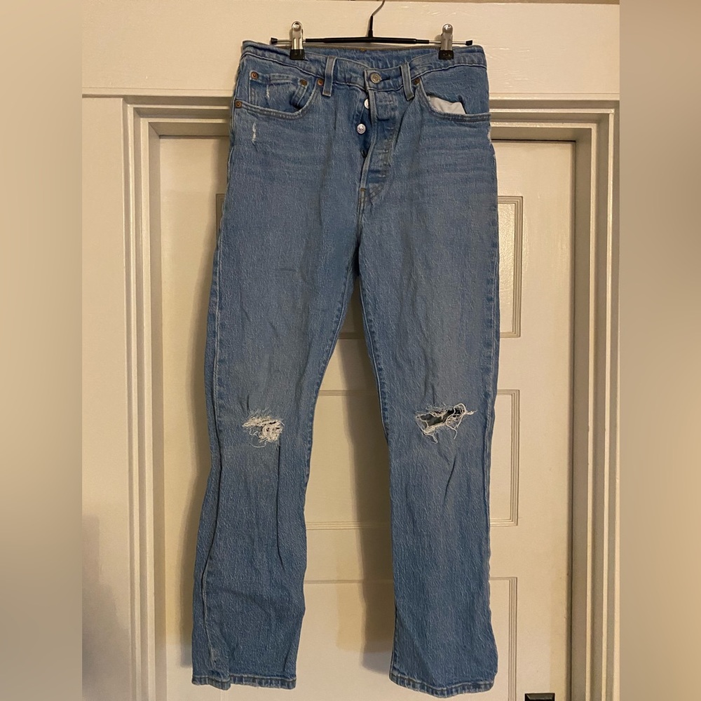 501 Levi pants, blue light wash. High wasted, buttons all the way up.